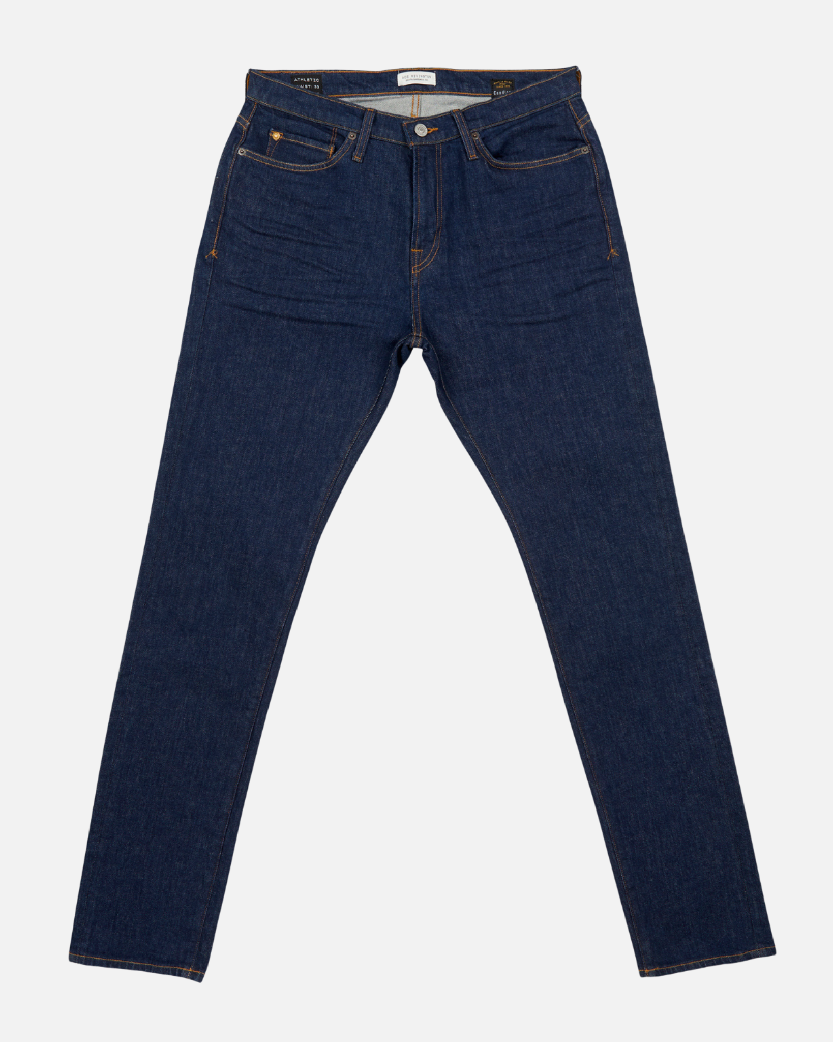 front of pair of dark blue men's athletic taper jeans with no wear and legs fully extended