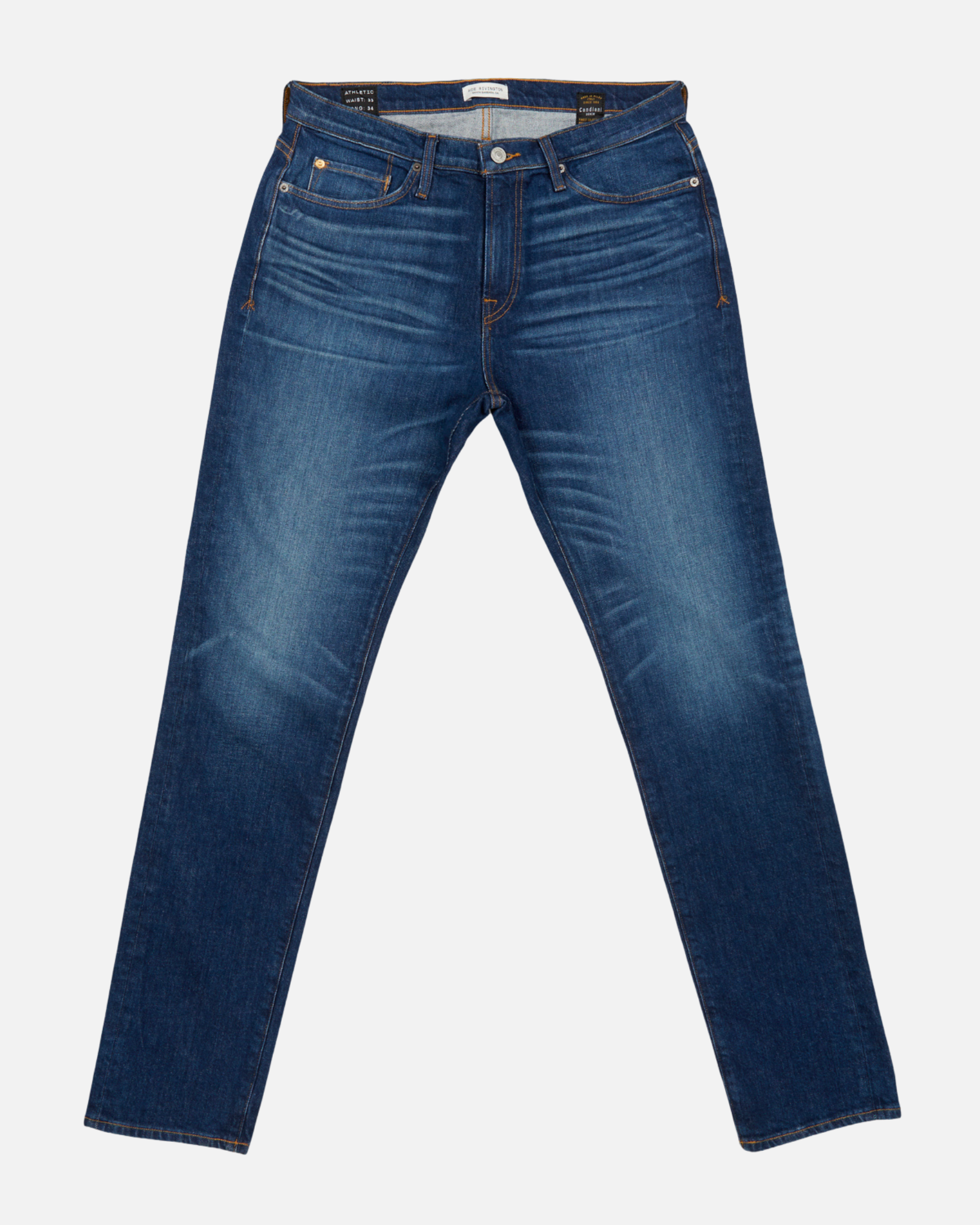 pair of dark blue vintage athletic taper jeans with fully extended legs