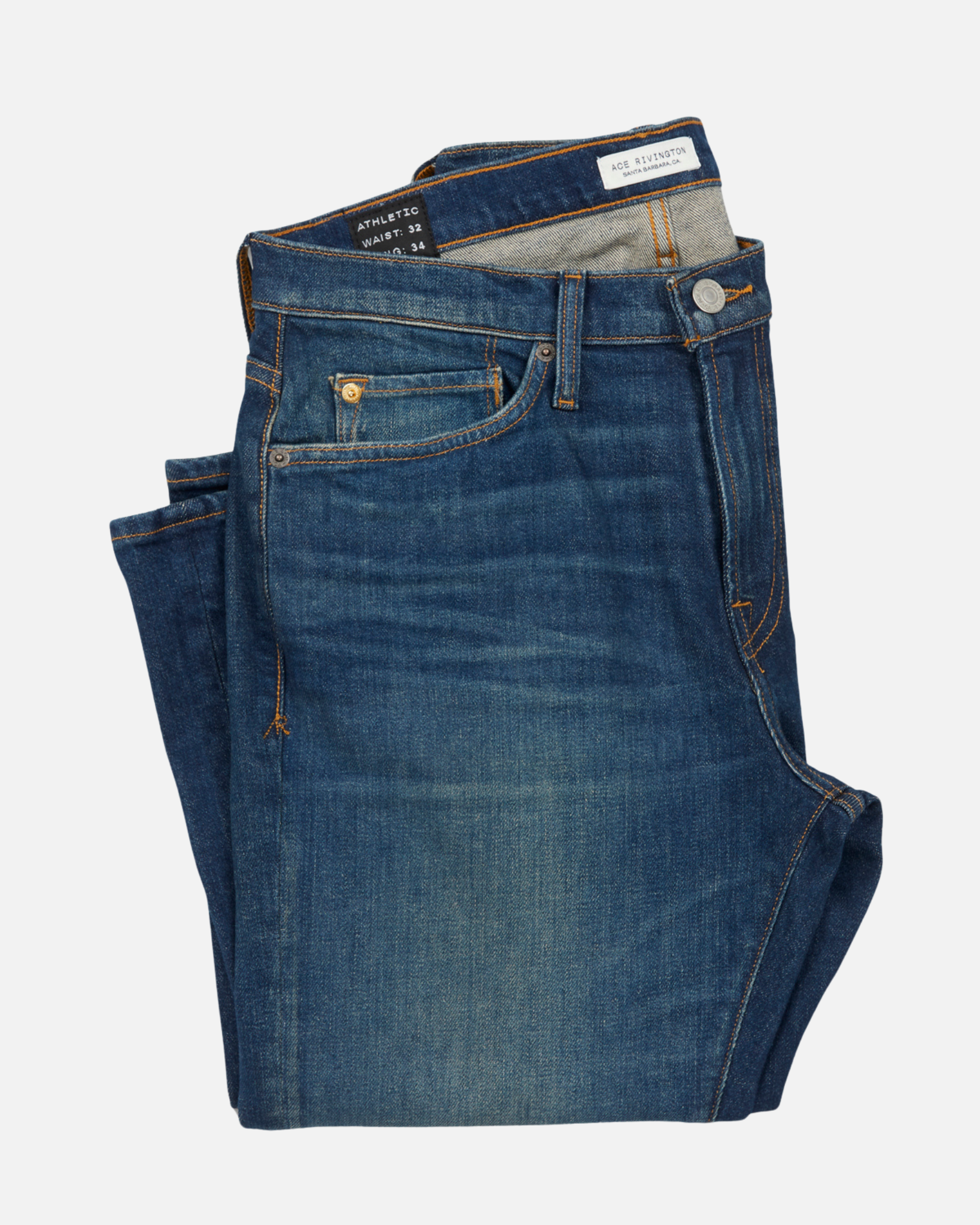 folded pair of men's athletic taper blue jeans with slight wear