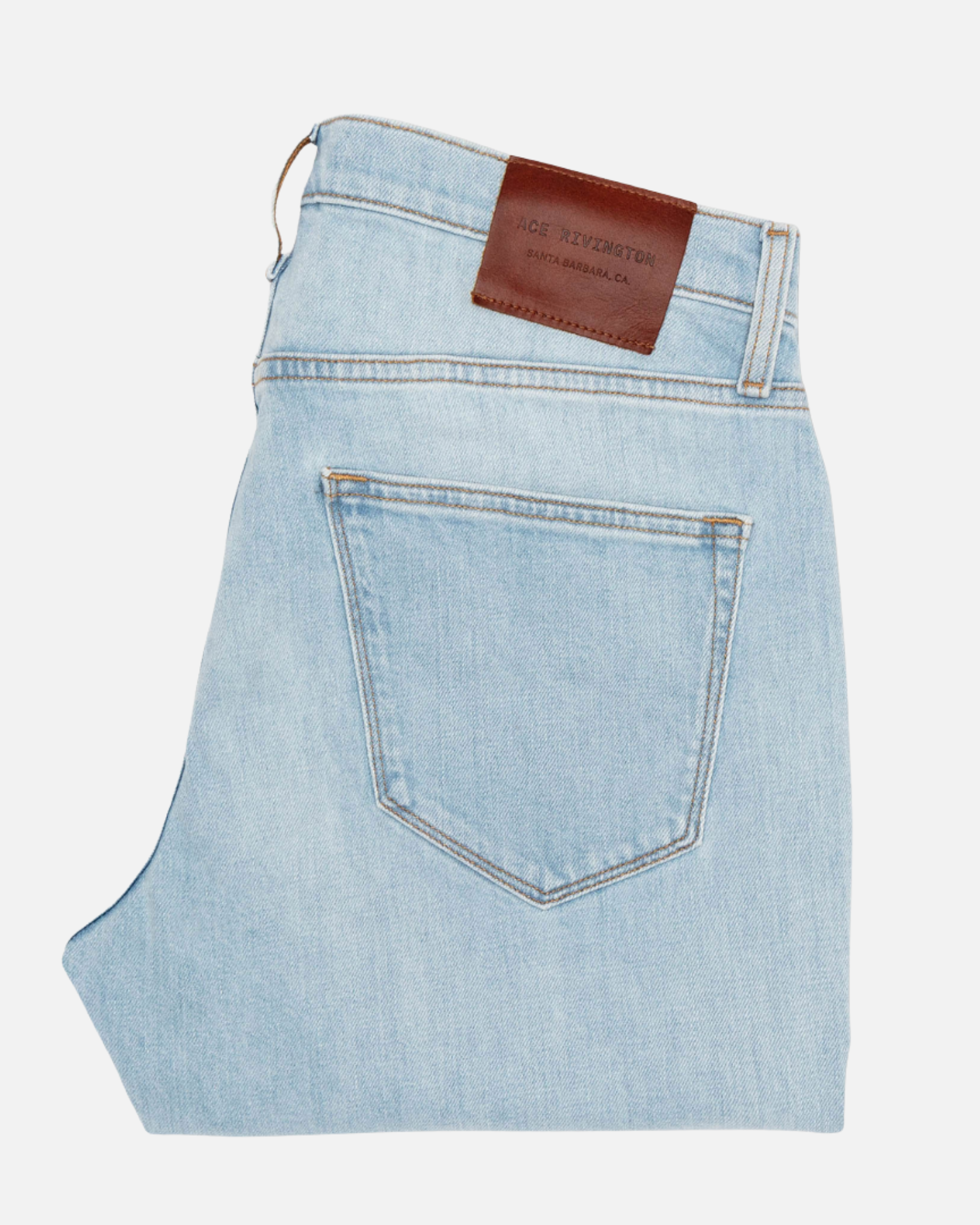 back of folded pair of Ace Rivington super light blue denim jeans with antique nickel detailing