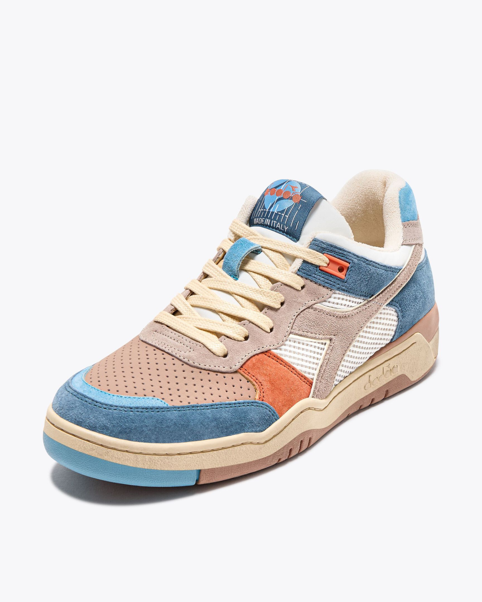 Diadora B.560 USED - Tourney Italia shoe front-side view highlighting the lacing system, perforated toe box, and textured paneling.