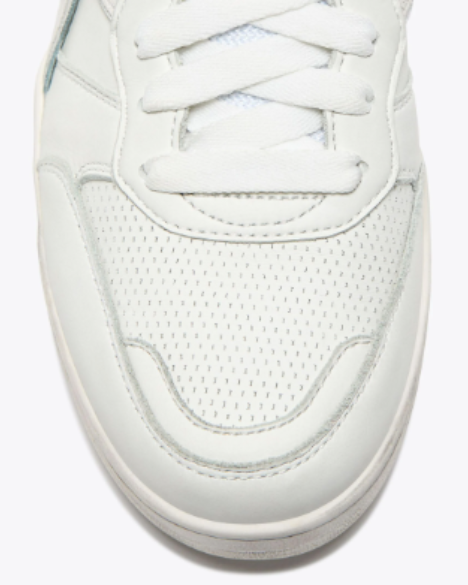 Diadora B. 560 USED - White shoe close-up of perforated mesh toe box with white leather overlays and tonal stitching.