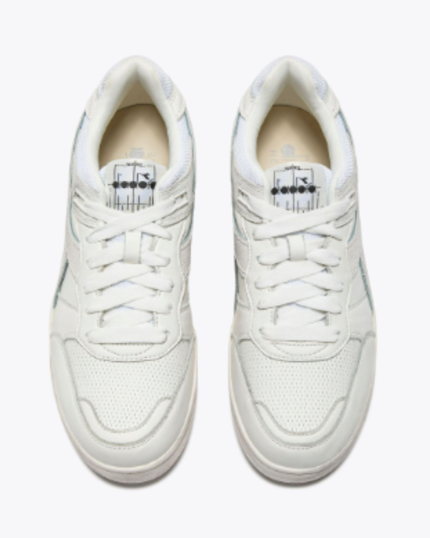 Diadora B. 560 USED - White shoe pair top-down view showing padded collars, white laces, and retro-inspired tongue graphic.