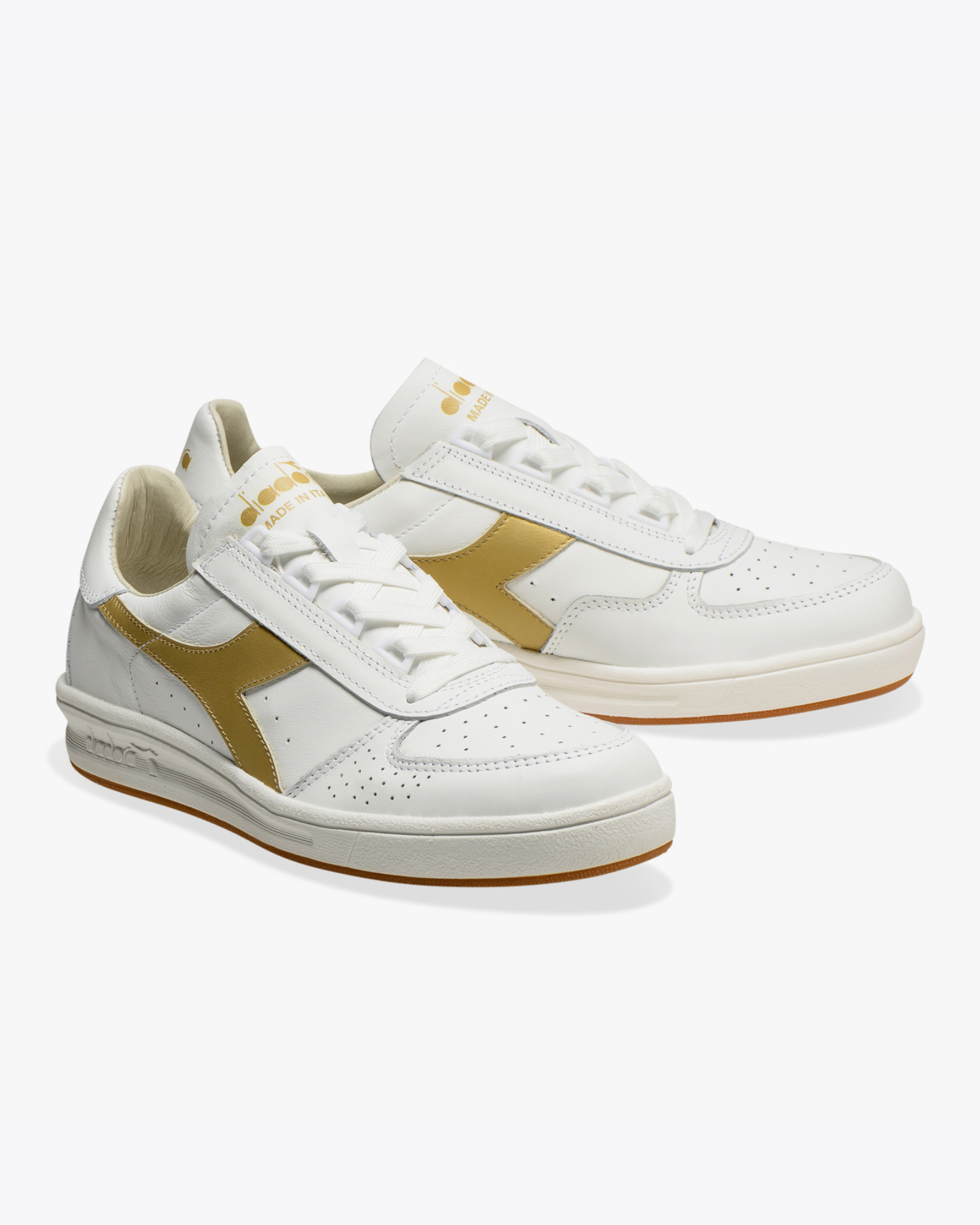 Diadora - B.Elite H Italia Sport - White / Gold shoe angled pair view displaying perforated toe box, gold branding, and layered sole construction.