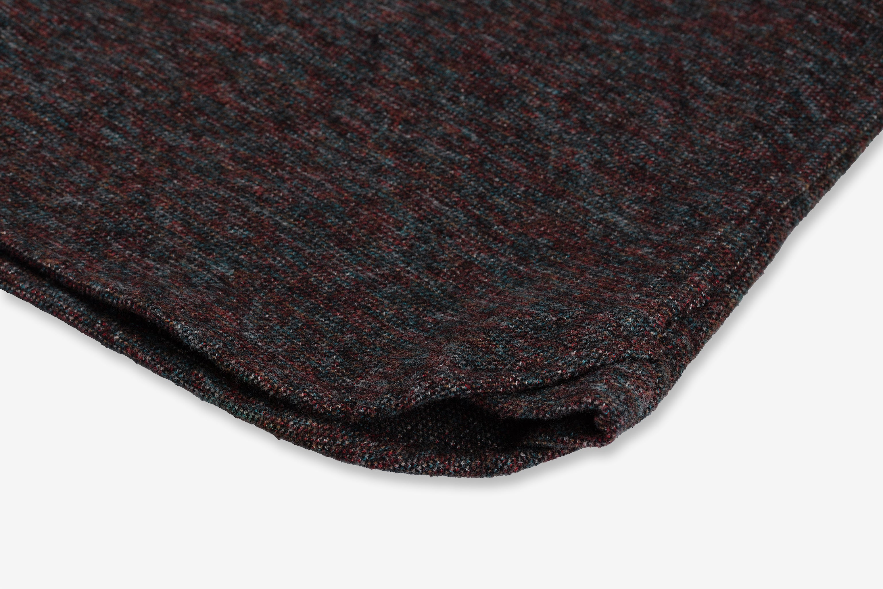 Close-up of a folded piece of Flannel - Utility Shirt - Iron Opal, showing the texture and stitching details by Ace Rivington.