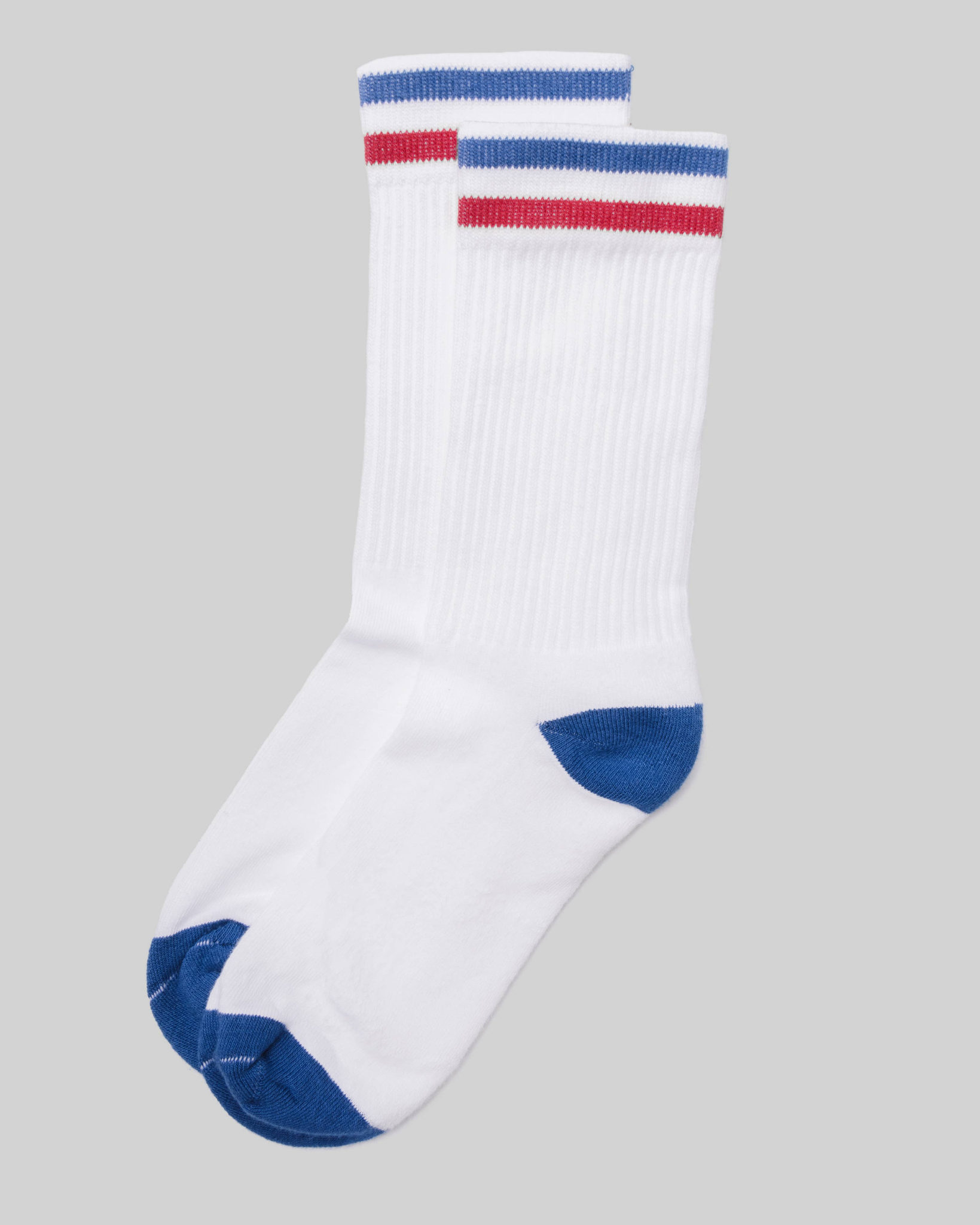 Kennedy Luxe Athletic Socks - White/Blue/Red laid flat from a top-down angle with red and blue cuff stripes and blue heel and toe on a light grey background.