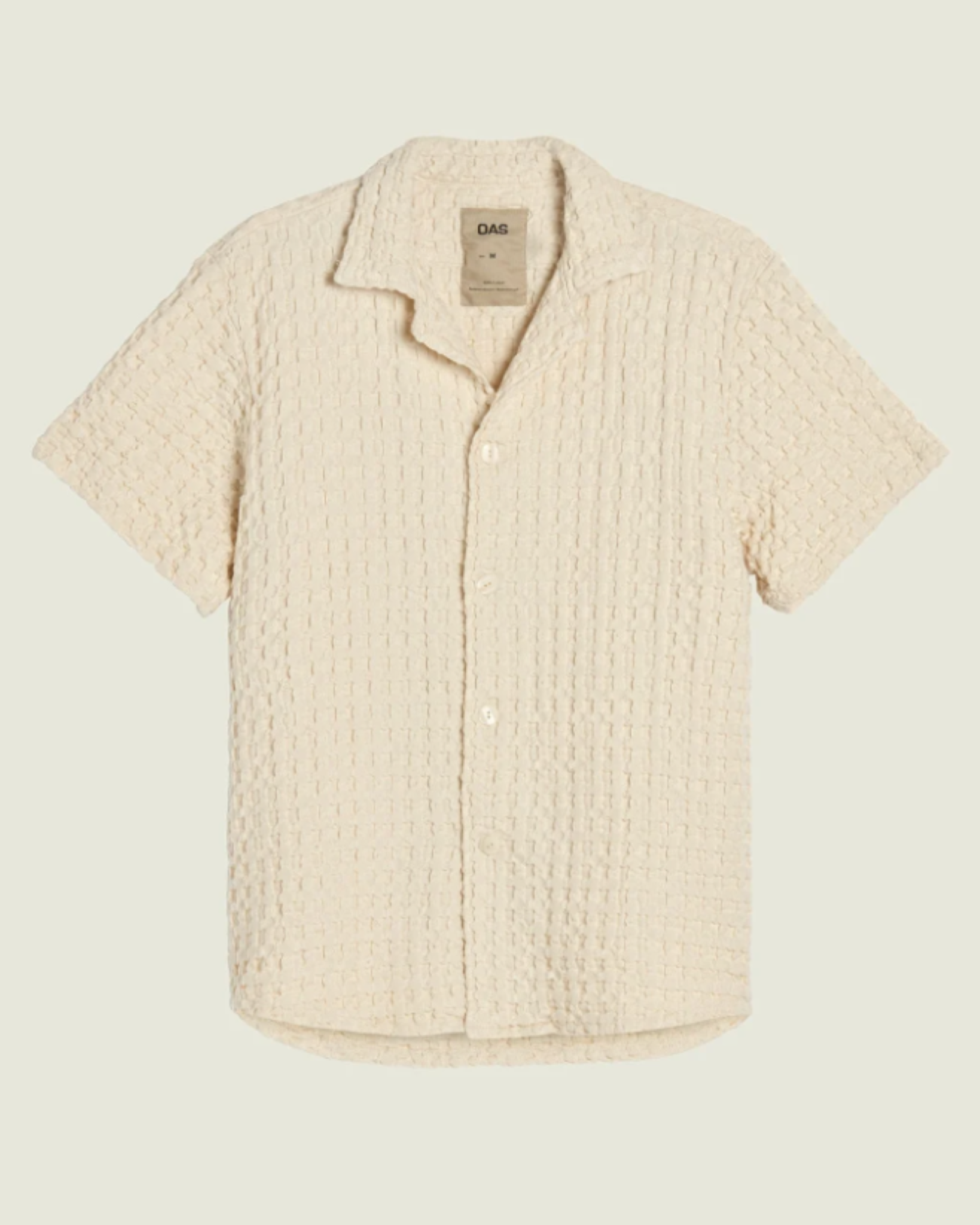 OAS Waffle - Cuba Shirt - Ecru displayed front-facing on a flat lay background, highlighting its textured waffle fabric and relaxed, button-down silhouette.