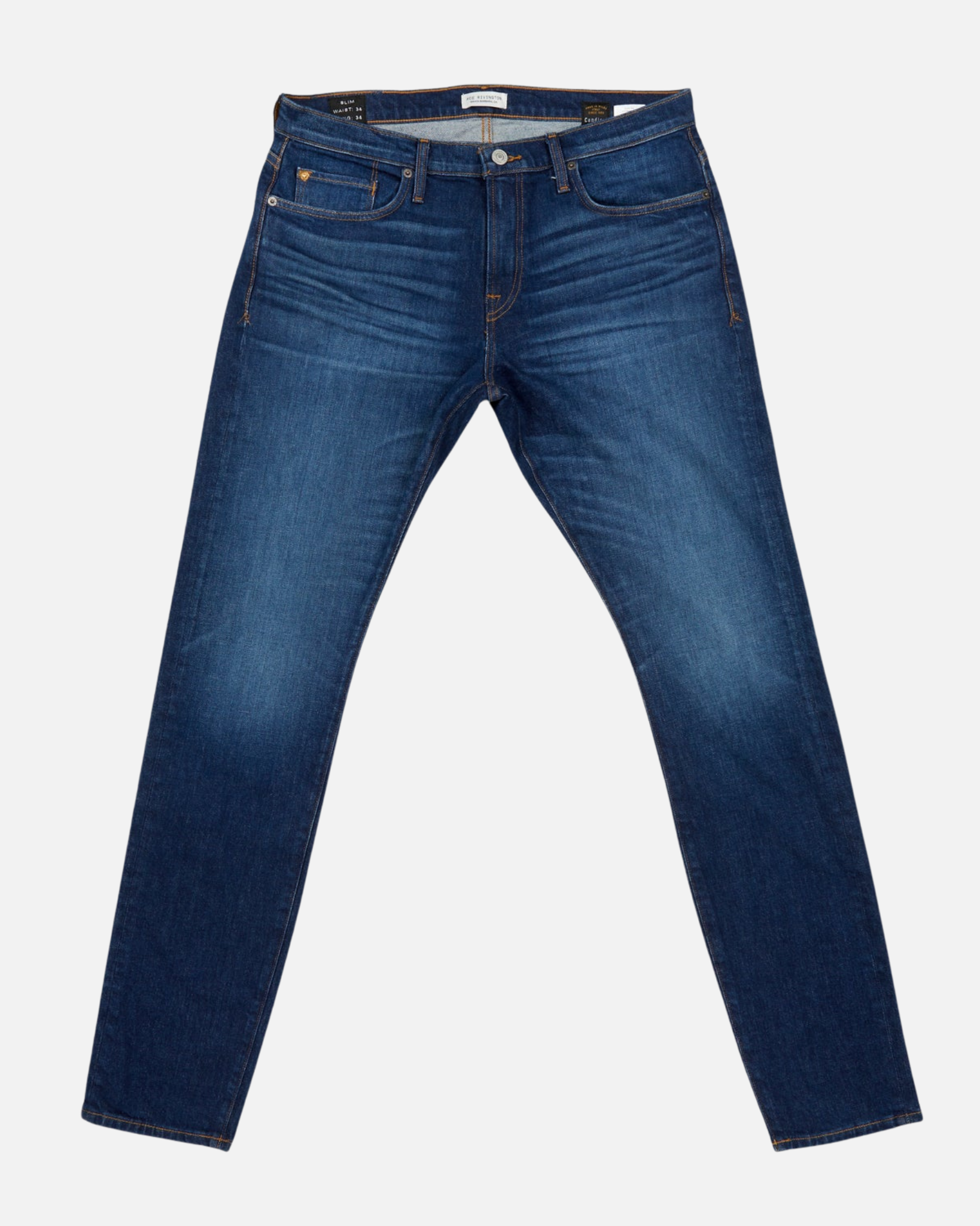 fully extended front of pair of high quality slim cut men's dark blue jeans with slight wear