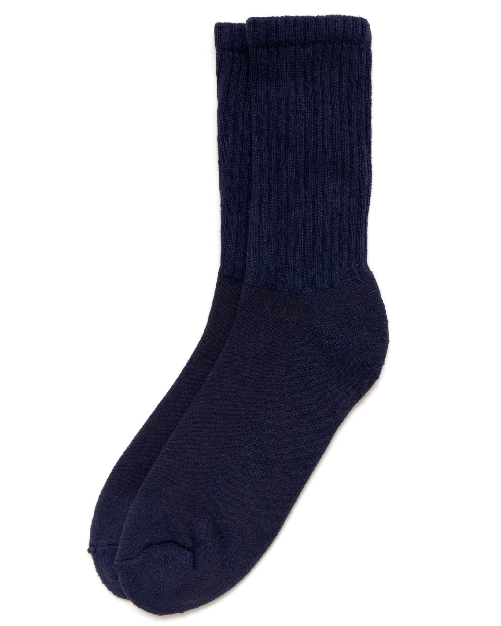 The Solids - Navy in a top-down view with a deep navy tone and ribbed upper on a white background.