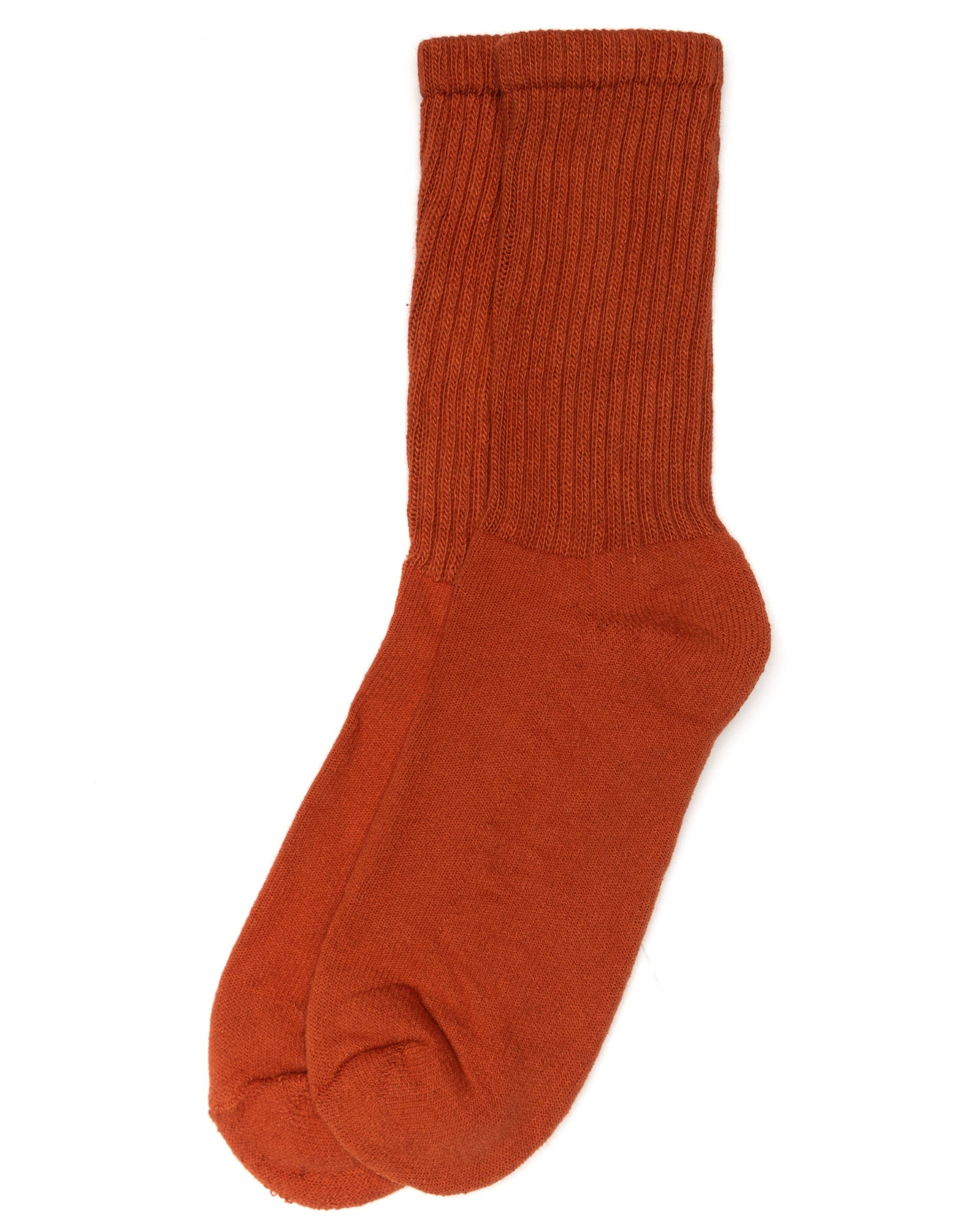 The Solids - Rust orange top-down view with ribbed mid-calf length, with cushioned sole on a white background.