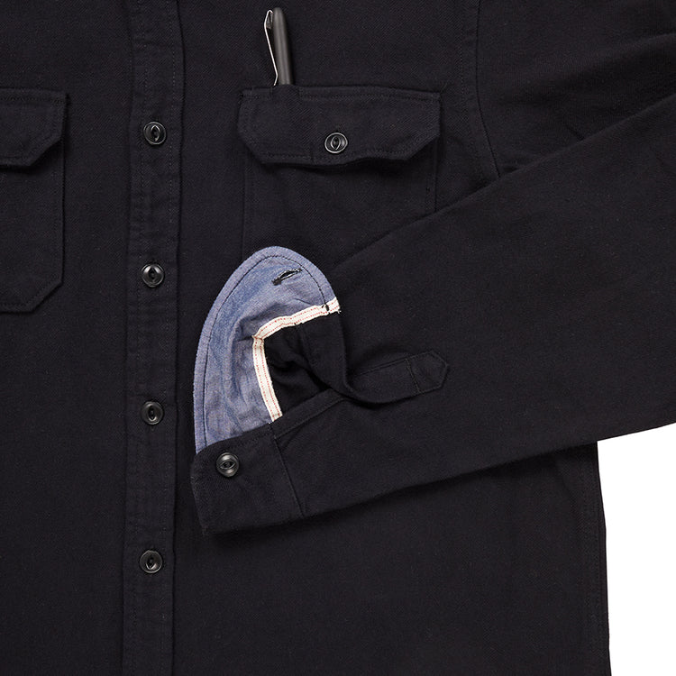 close up of sleeve cuff and breast pocket with pen of men's black soft brushed flannel shirt 