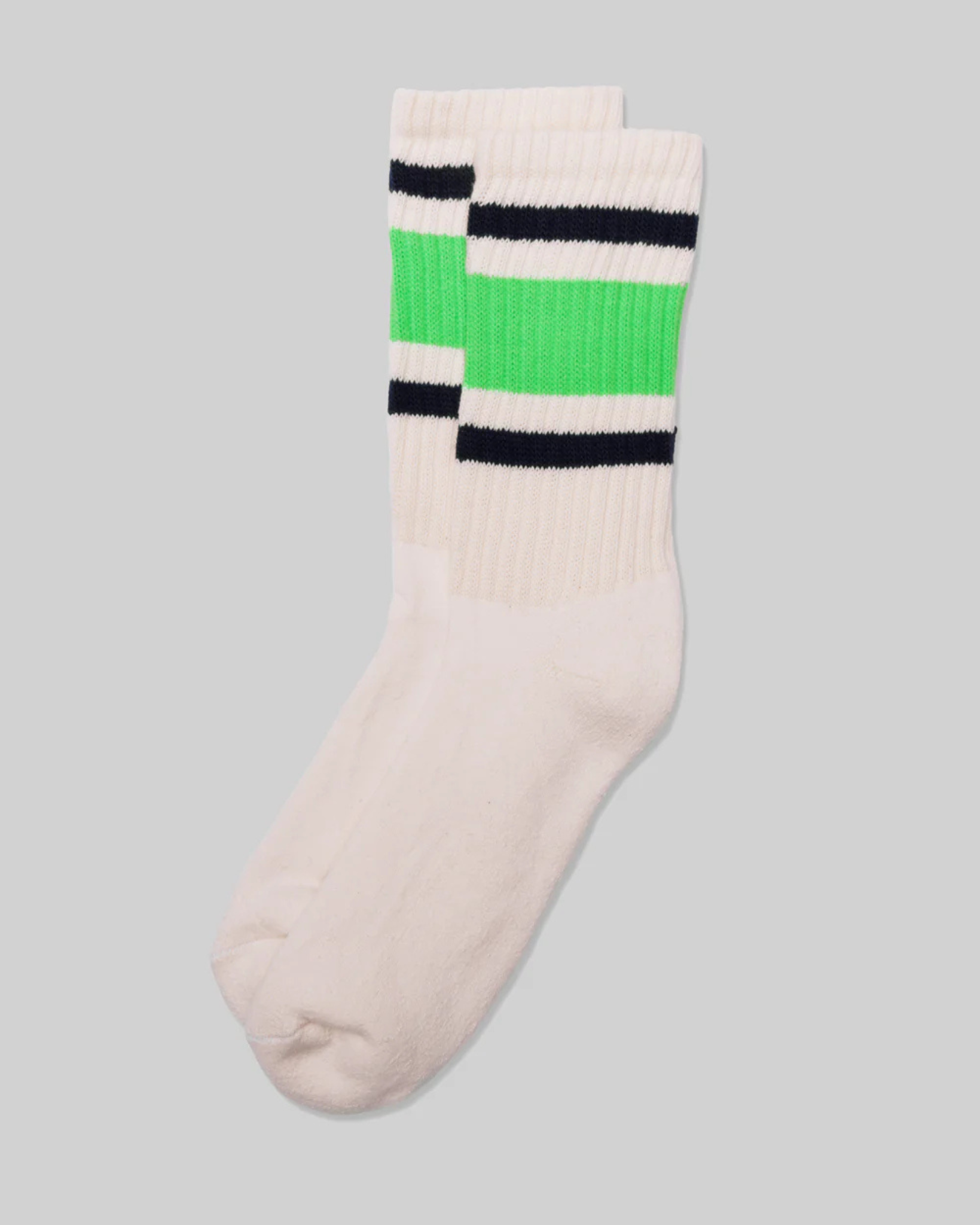 American Trench Retro Stripe Socks in Neon Green, Navy, and White feature bold neon green and navy stripes on a light grey background. This design is reminiscent of vintage athletic socks, adding a nostalgic and stylish flair.