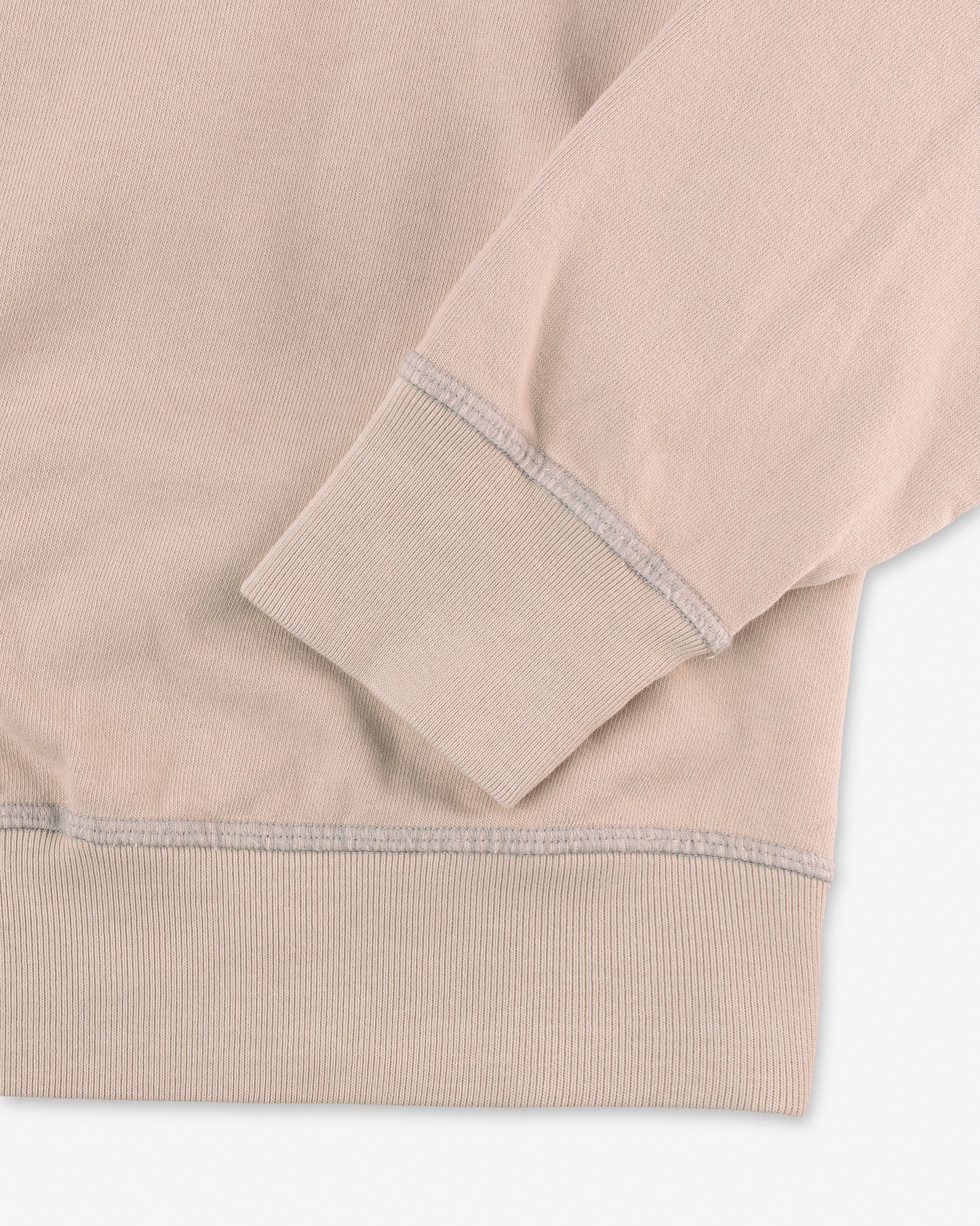 close up of hem and collar on front of men's light beige khaki long sleeve sweatshirt made with organic cotton