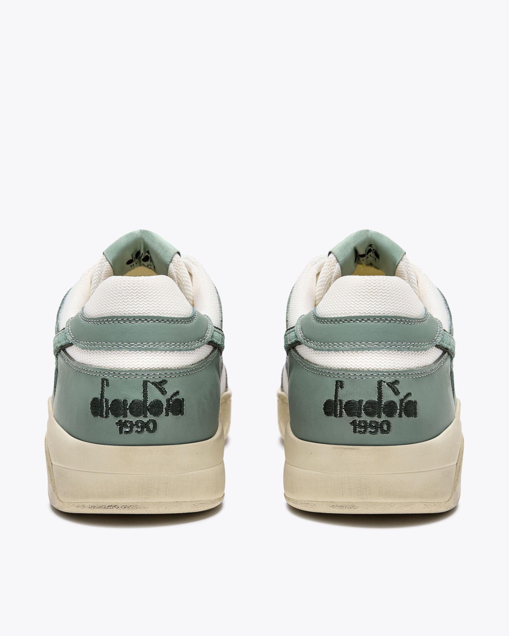 Diadora B. 560 USED - Iceberg Green shoe rear view with black embroidered heel branding and tonal green leather heel panel.
