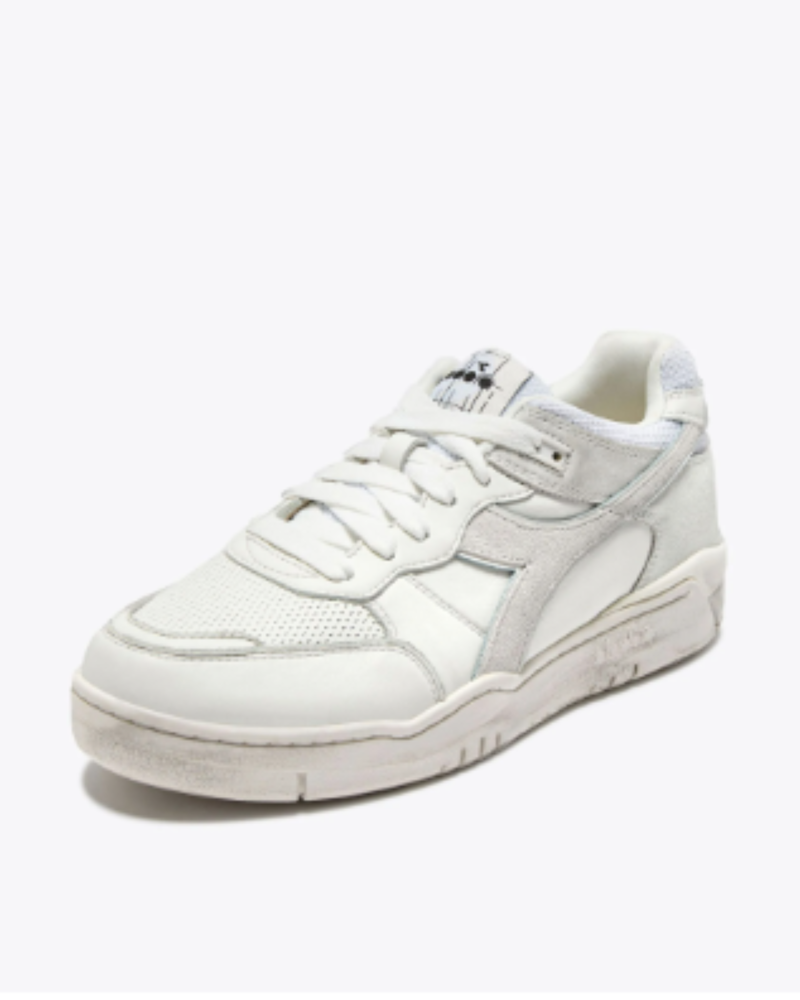 Diadora B. 560 USED - White shoe angled left side view highlighting mesh toe, suede overlays, and tonal off-white finish.
