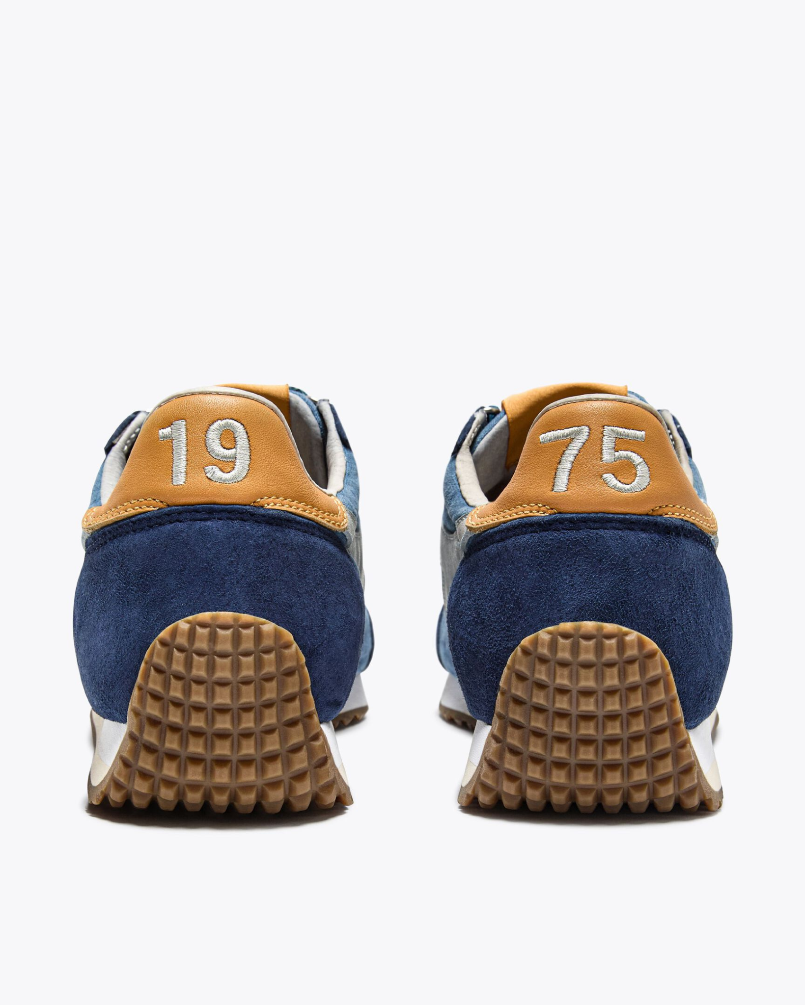 Diadora - Equipe Canvas SW EVO - Blue Coop rear view of both shoes displaying ochre heel tabs with embroidered “1975” and gum sole tread texture.