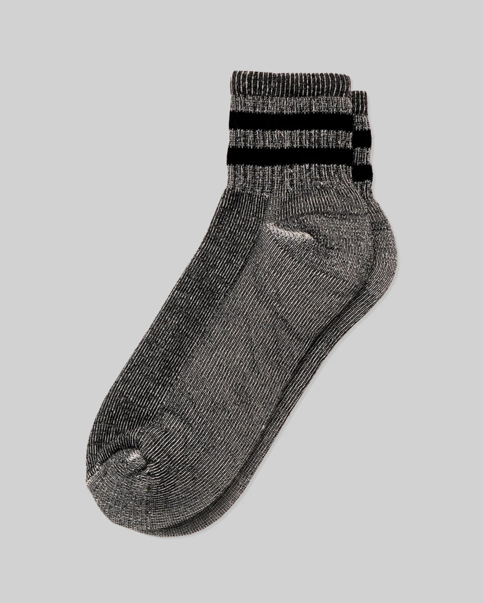 Merino Activity Quarter Grey with Black laid flat in a top-down view with black double stripe detailing on a heathered grey body against a light grey background.