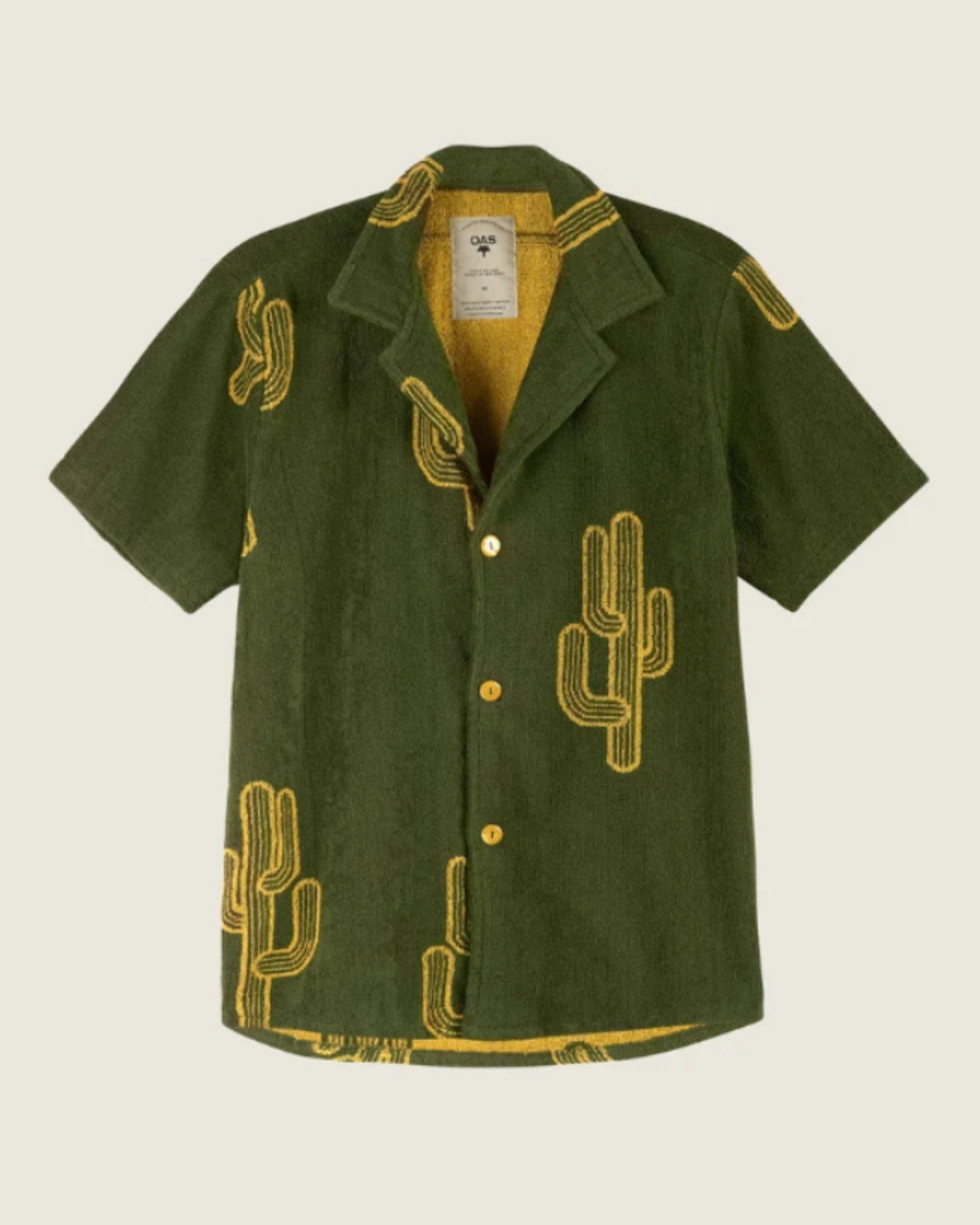 OAS Terry - Cuba Shirt - Mezcal flat lay of a short-sleeve terry shirt in deep green with yellow cactus embroidery, featuring a relaxed collar and tonal buttons.
