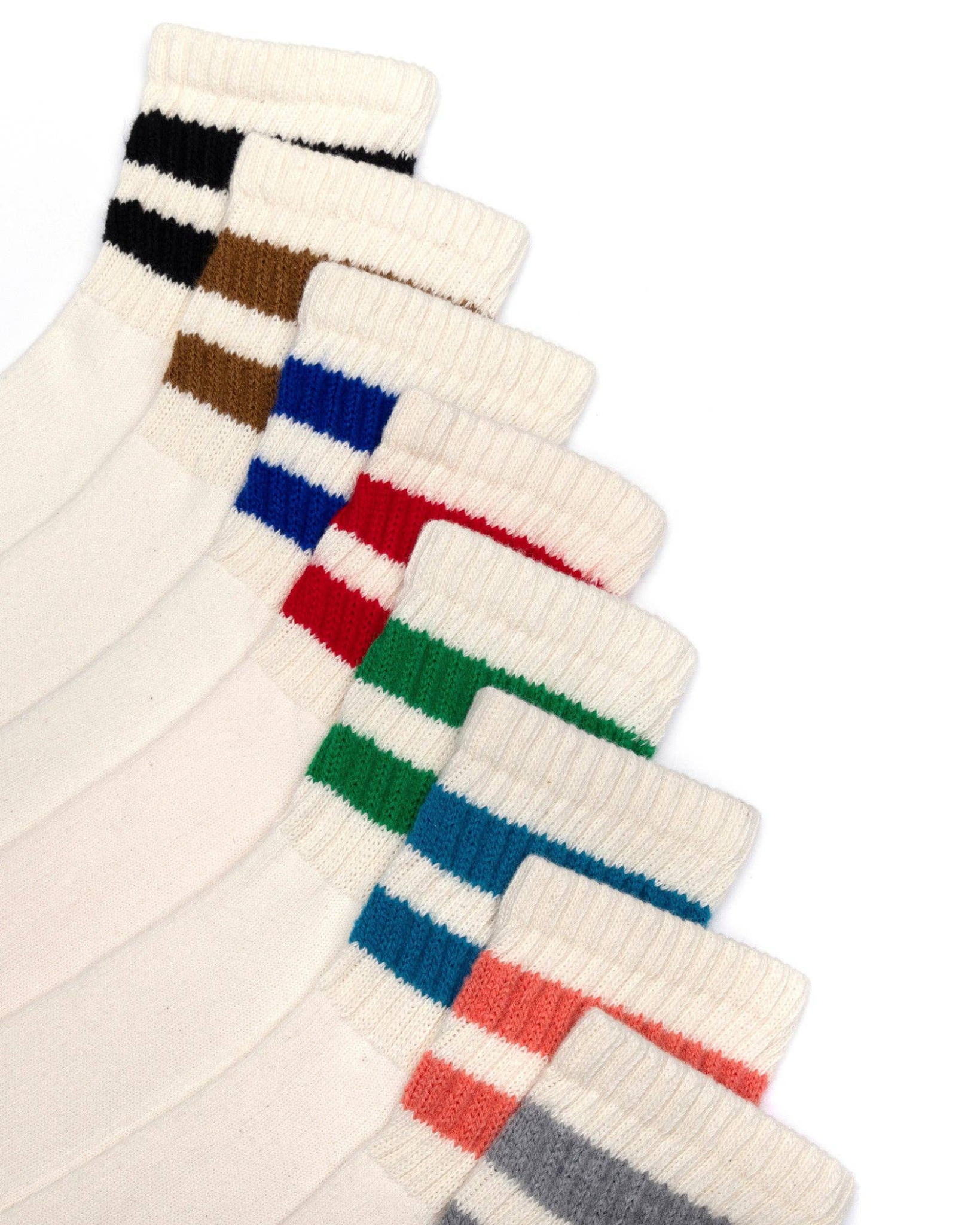 The Mono Stripe Quarter Crew - Full Collection laid out diagonally in overlapping rows, showcasing all color stripe options on a white background.