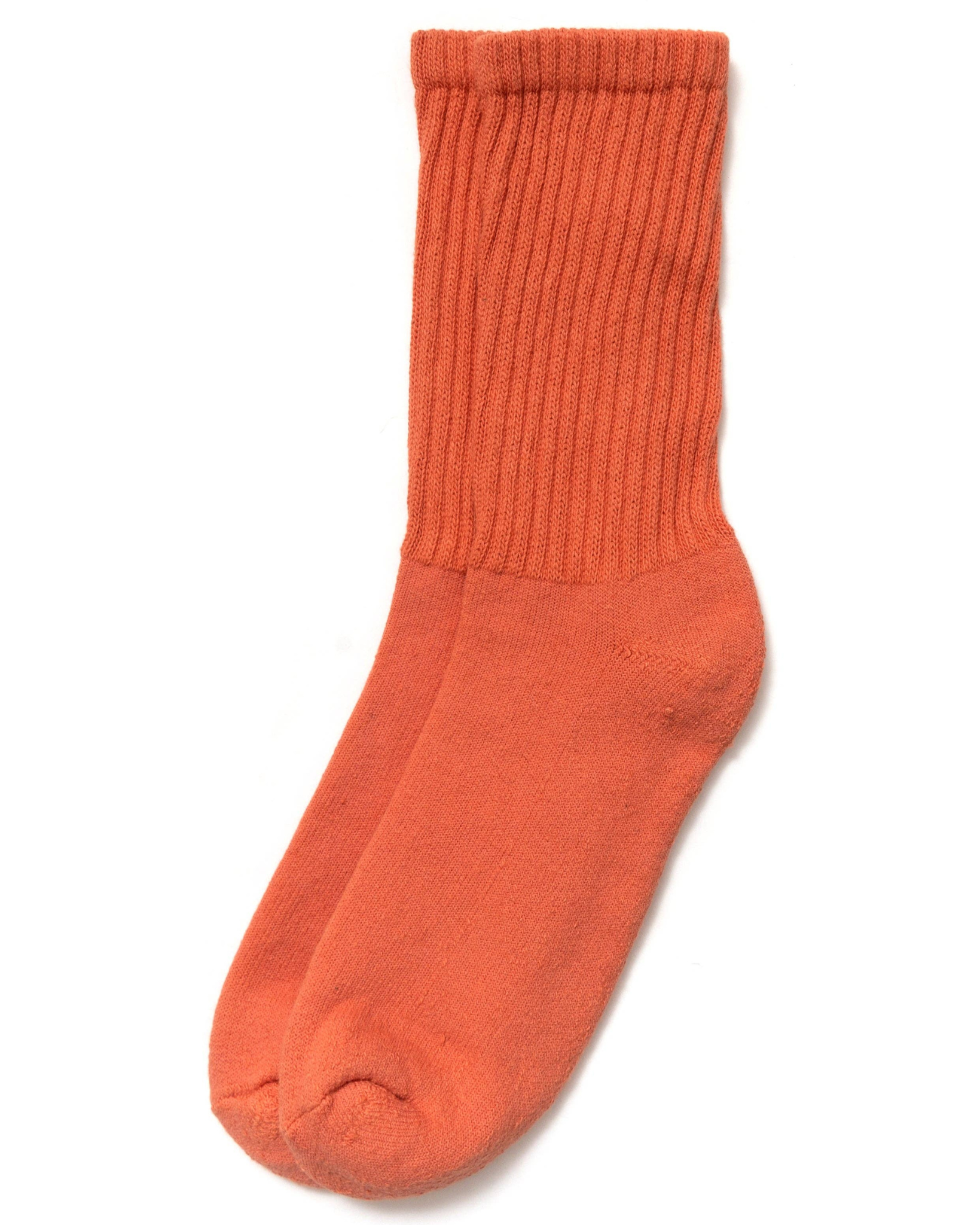 The Solids - Pumpkin orange top-down view of ribbed socks with warm, earthy tones on a white background.
