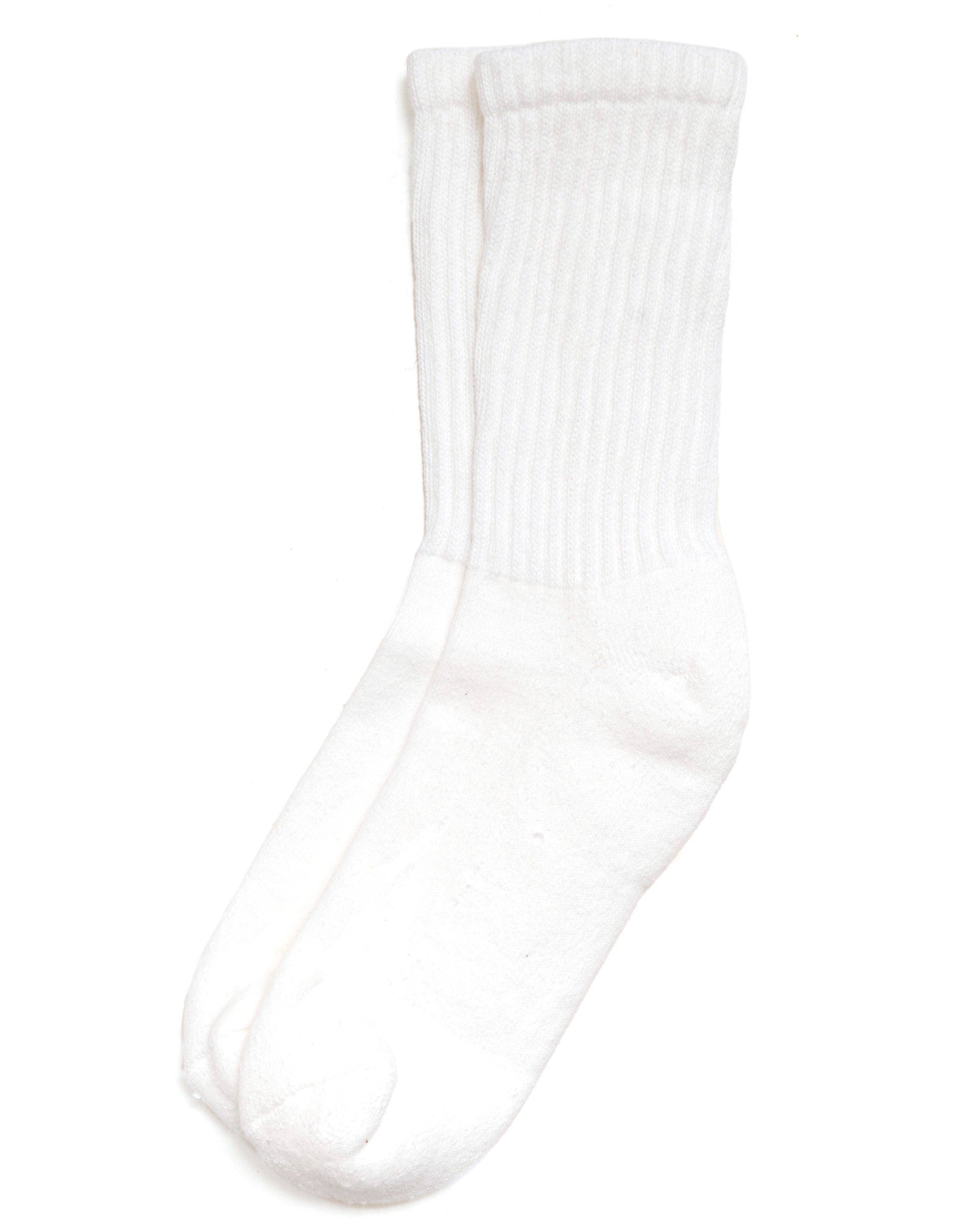 The Solids - White in a top-down view of crisp white ribbed socks with a tonal foot and cuff construction on a white background.