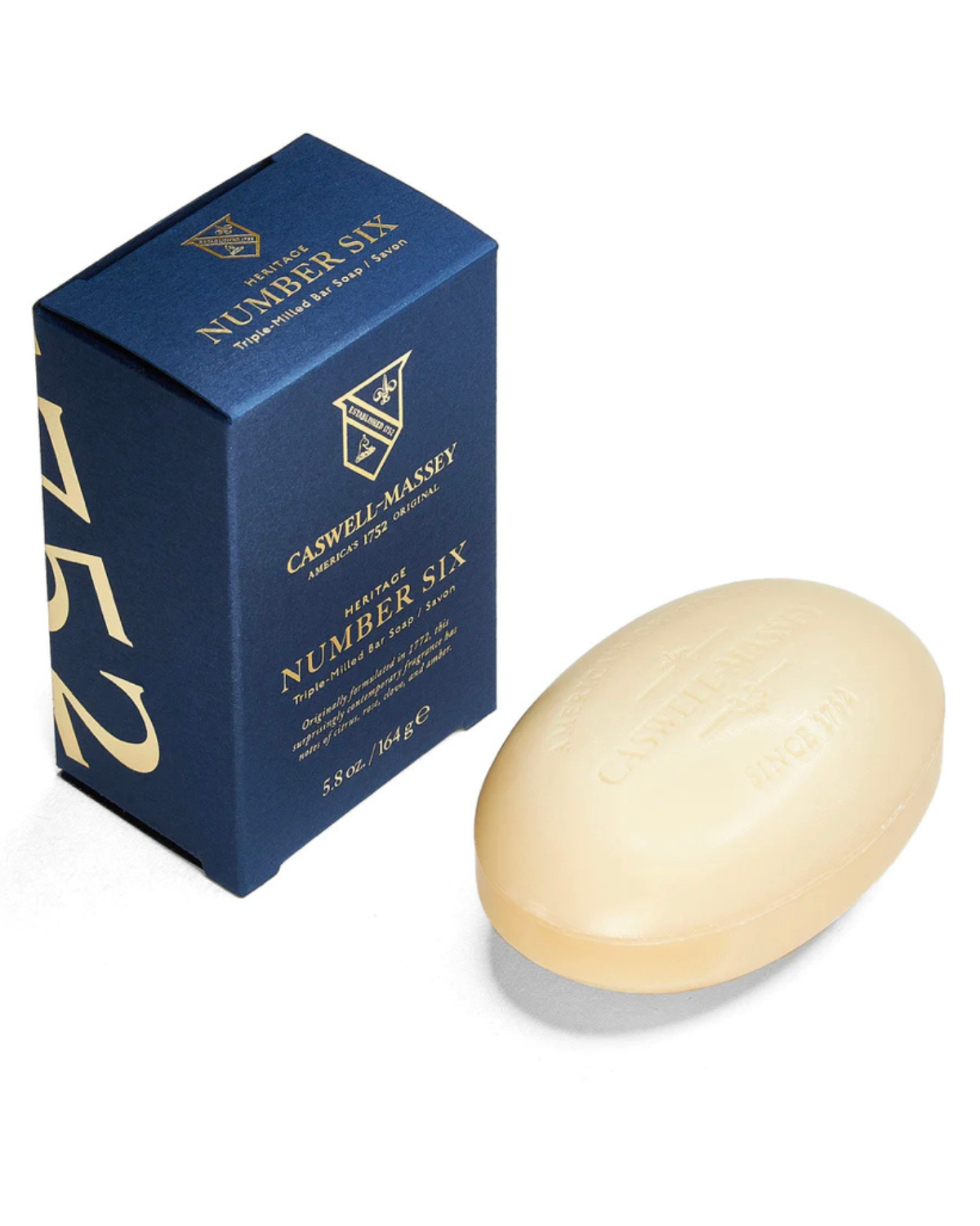 Ace Rivington Caswell-Massey Heritage Number Six soap shows a blue box with gold lettering and a matching oval-shaped soap bar. The box is labeled 'Caswell-Massey Heritage Number Six Triple-Milled Bar Soap Since 1752.' The soap bar is embossed with similar branding.