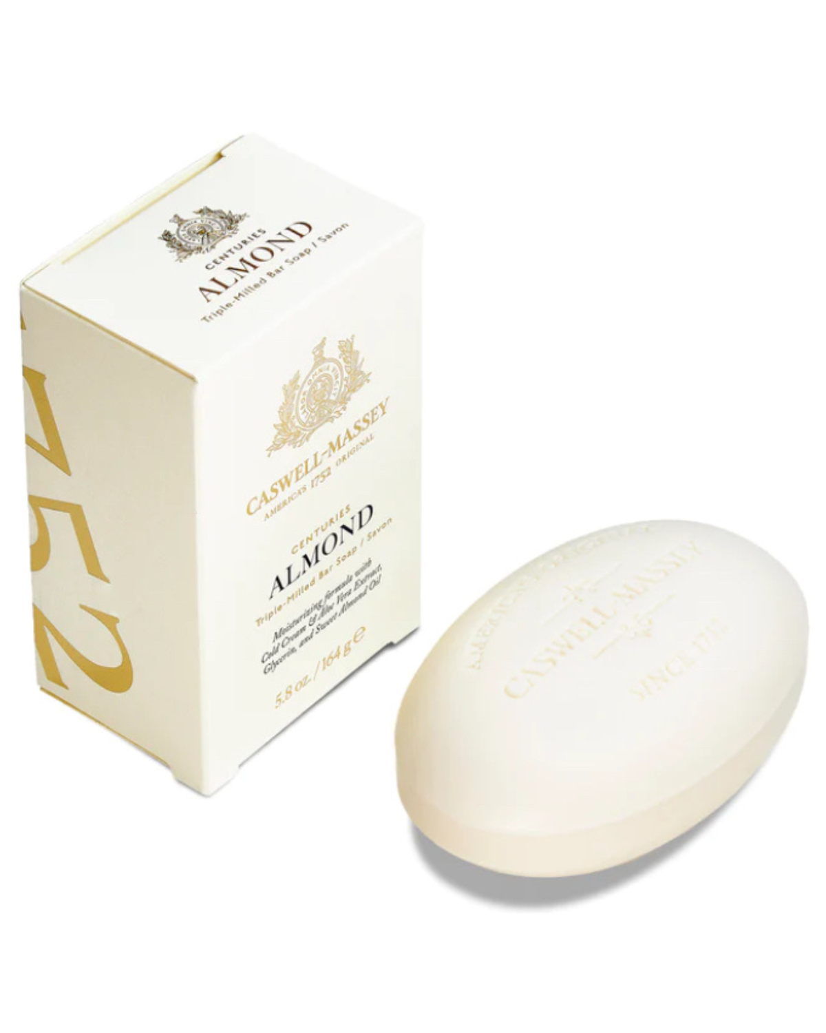 Ace Rivington Caswell-Massey Centuries Almond Bar Soap shows a white rectangular box with gold text and design, and an oval-shaped bar of soap placed next to it. The box features the Caswell-Massey logo and the text 'Centuries Almond' along with details about the product. The soap bar is embossed with similar branding and text.