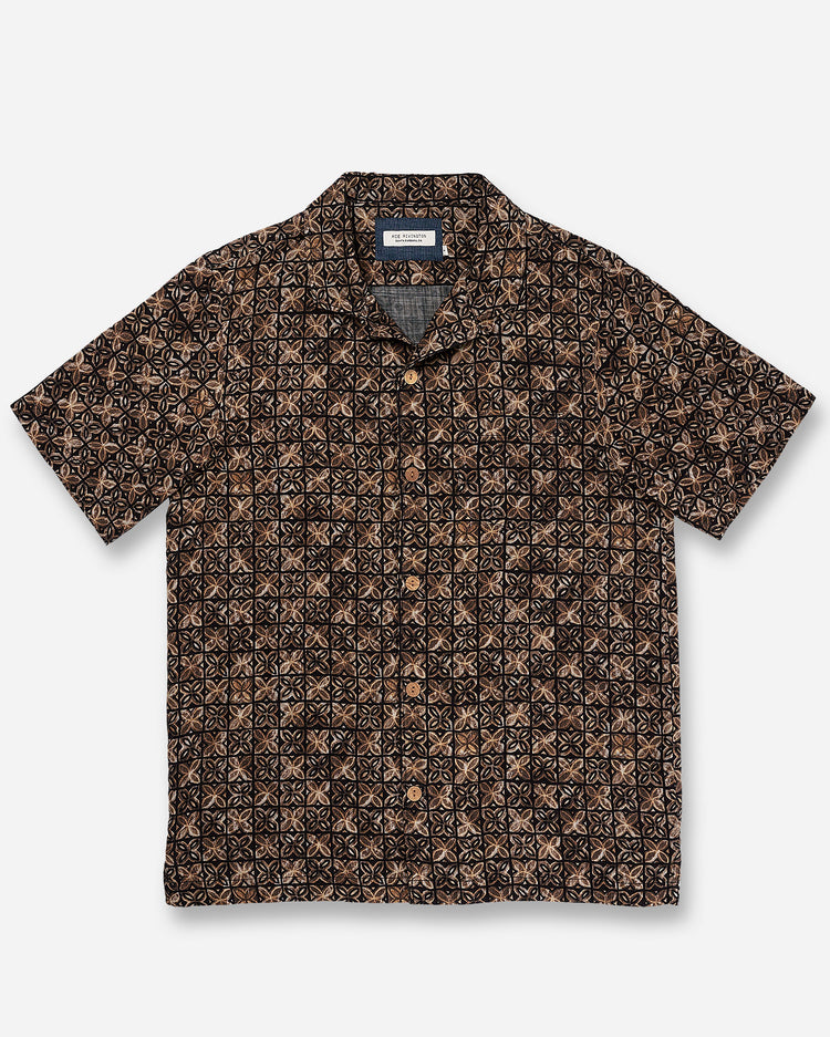 Front of flat lay of Ace Rivington "Vintage Tile" gold, brown, and black exclusive design camp-collar shirt with coconut buttons and doubles-gauze soft-textured cotton fabric 