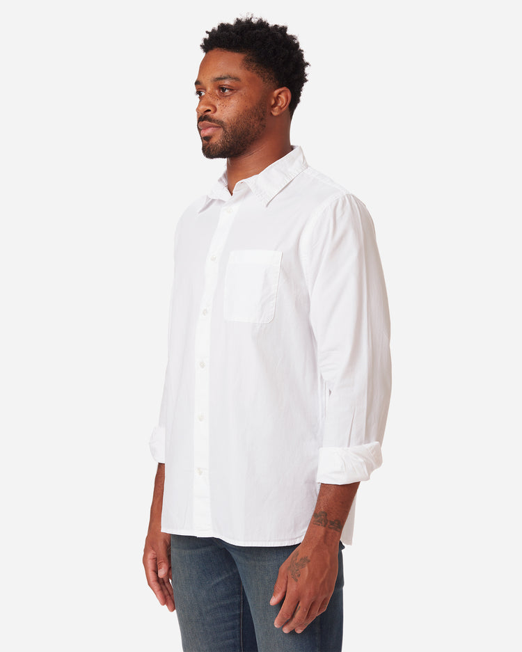 model facing front and rightward wearing men's white long sleeve tailored poplin shirt with color matched buttons and a single pocket in standard height option