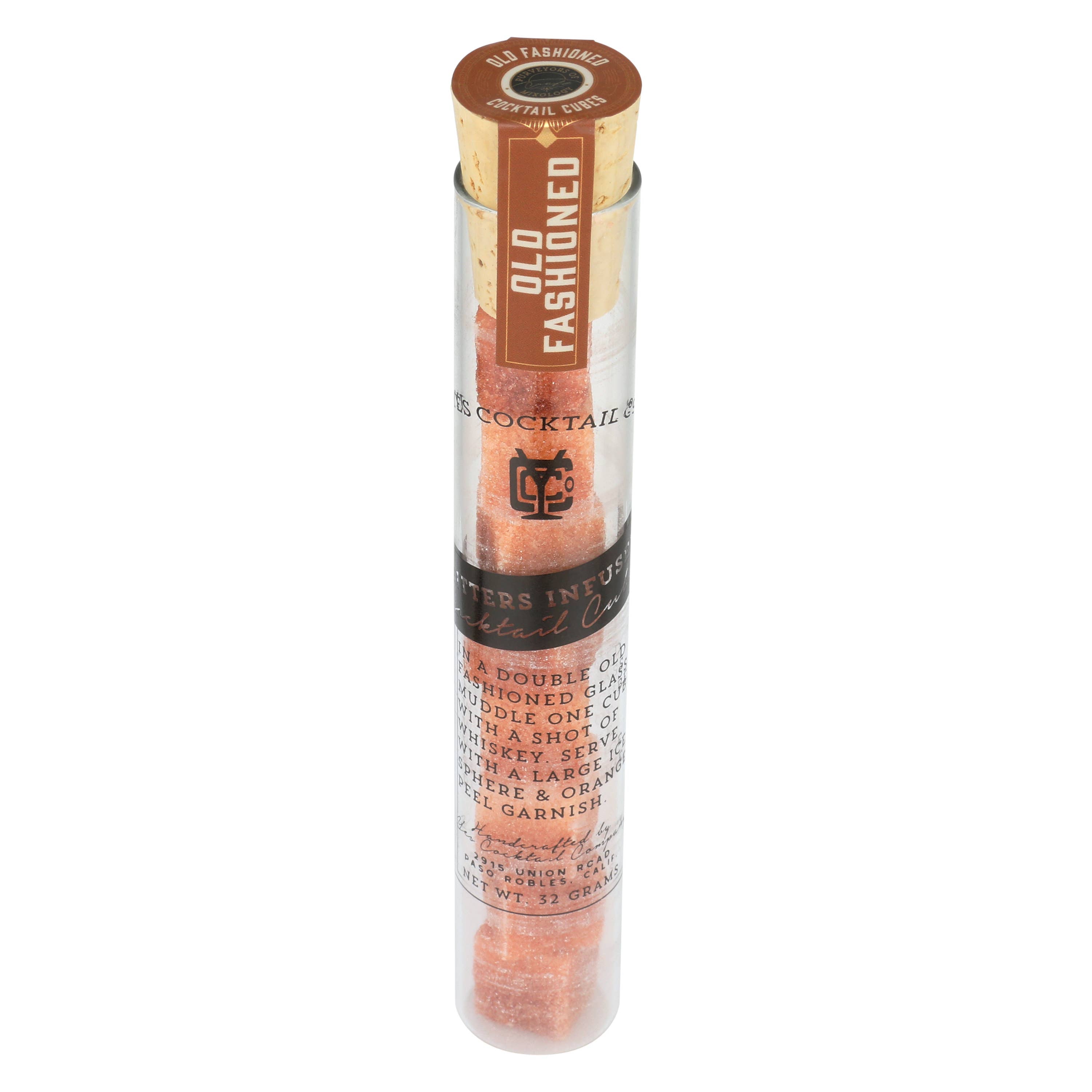 A clear cylindrical tube containing Ace Rivington Old Fashioned Bitters Infused Cocktail Cubes. The tube has a cork stopper and a label that reads 'OLD FASHIONED' vertically. The label also includes instructions for making an Old Fashioned cocktail, mentioning the use of a double Old Fashioned glass, one cube, a shot of whiskey, ice, and an orange peel garnish.