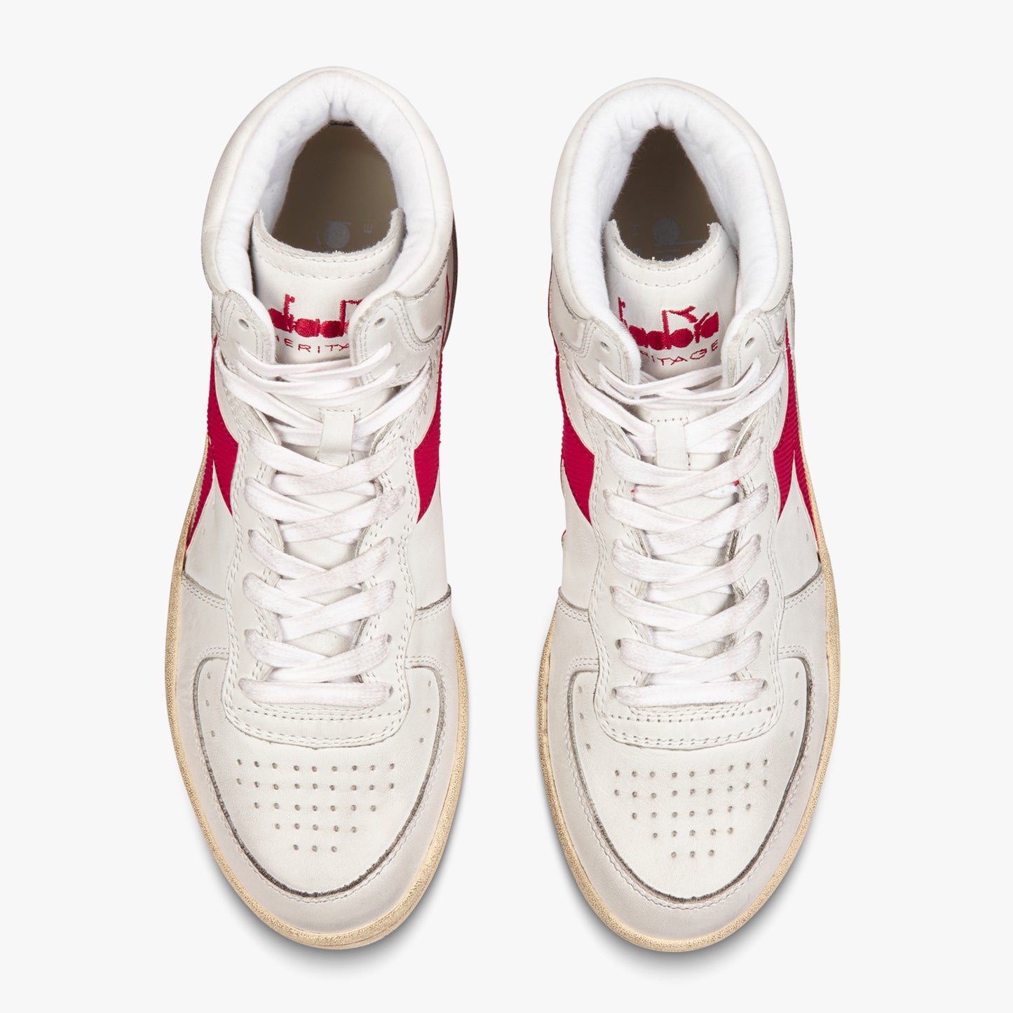 side by side aerial view from above of diadora white mi basket used shoes with red stripe