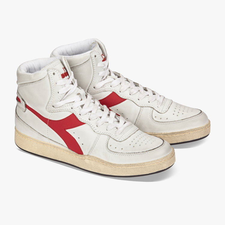 side by side angled view of diadora white mi basket used shoe with red stripe