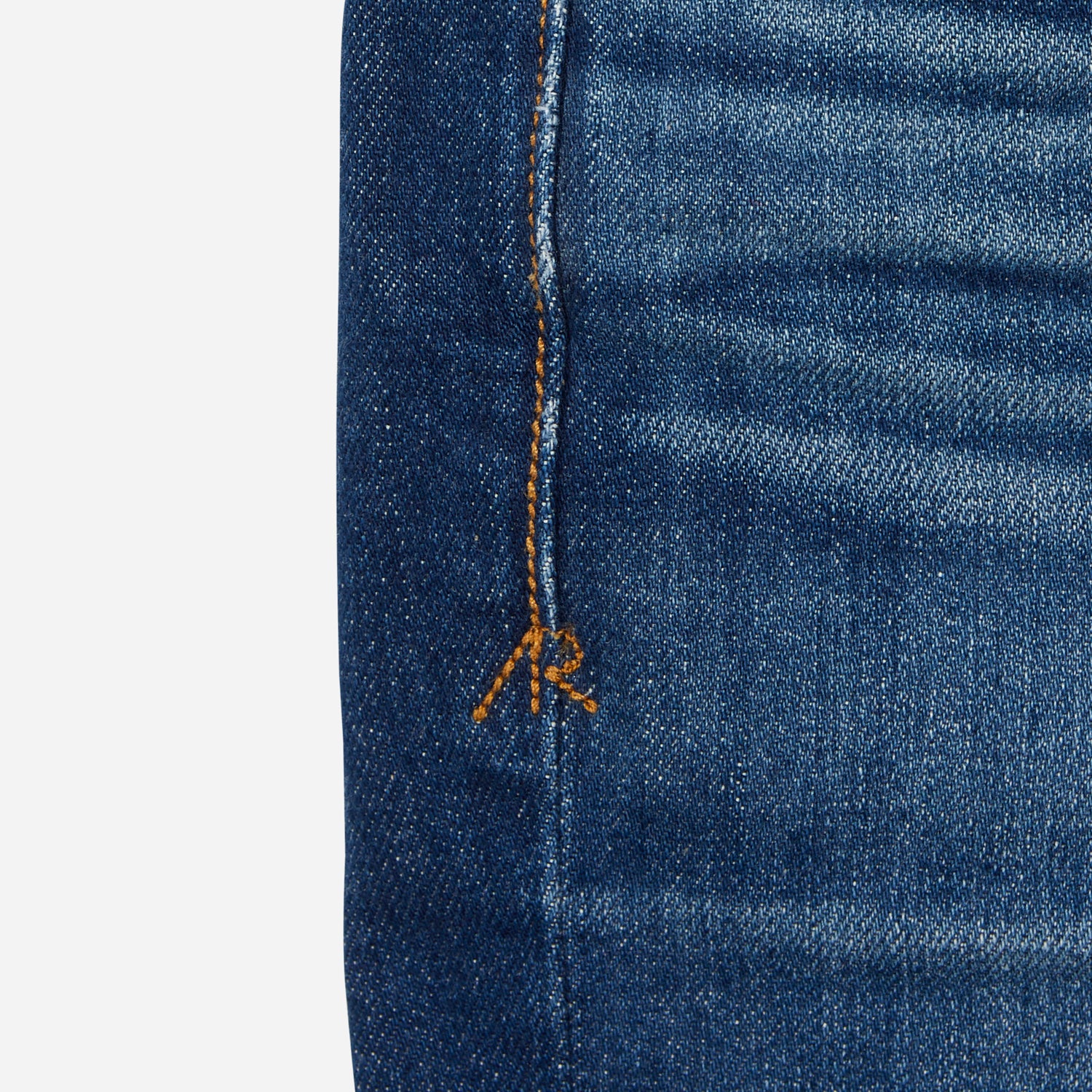 close up of stitching on dark blue vintage athletic taper jeans
