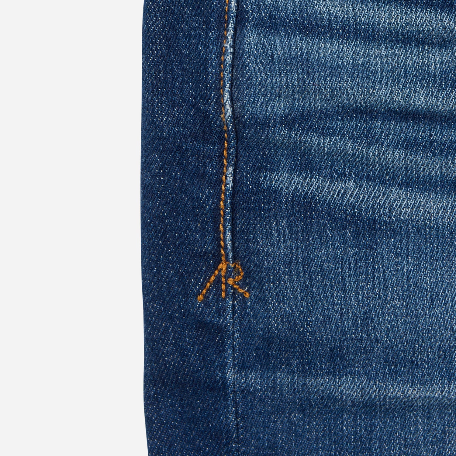 close up of stitching on dark blue vintage athletic taper jeans