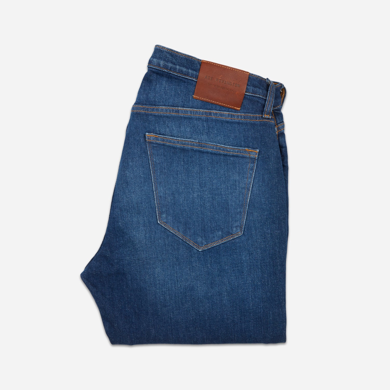 back of folded dark blue vintage athletic taper jeans