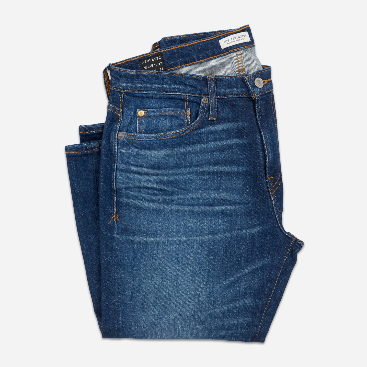 front of folded dark blue men's athletic taper vintage jeans with slight wear