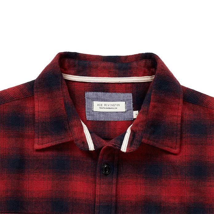 close up of collar and Ace Rivington logo tag on men's black and red plaid pattern flannel with white collar stripe