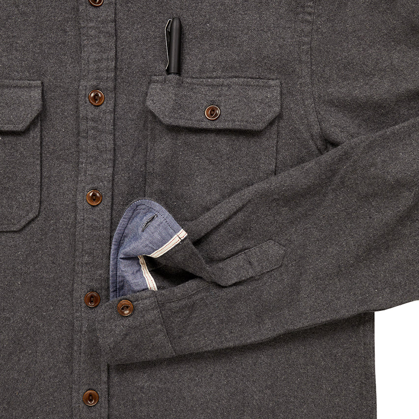 close up of pocket with pen and sleeve cuff on men's light grey flannel in standard height option