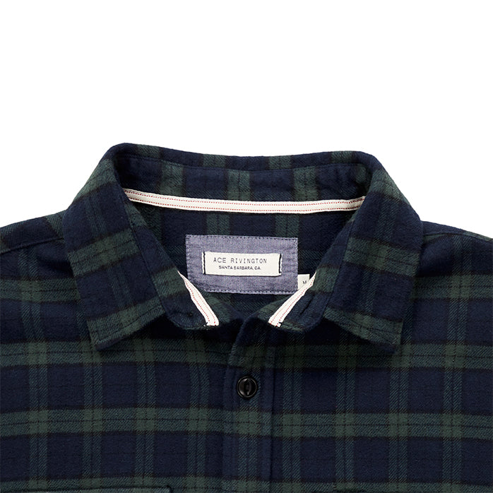close up of collar and Ace Rivington logo tag on men's blue and green plaid pattern flannel 