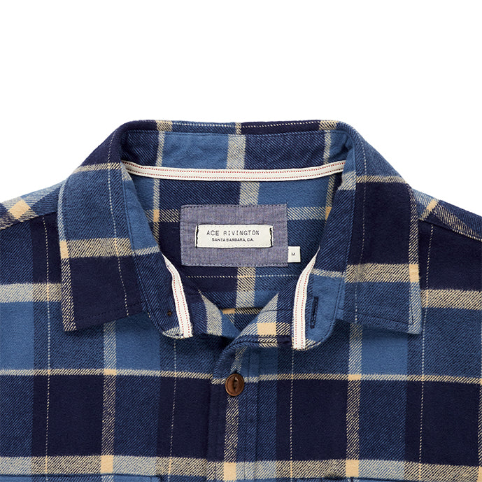 close up of collar and Ace Rivington logo tag on  men's off white dark blue and light blue plaid pattern flannel with brown buttons and white collar stripe in standard height option