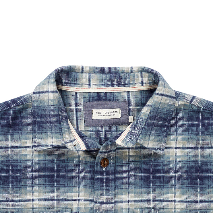 close up of collar and Ace Rivington logo tag on men's off white and light blue plaid pattern flannel with brown buttons and white collar stripe in standard height option