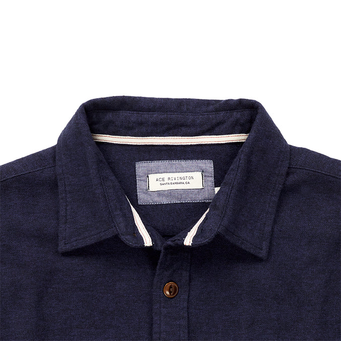 close up of collar and Ace Rivington logo tag on men's navy blue flannel with brown buttons and white collar stripe in standard height option