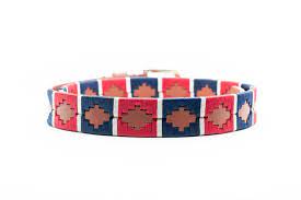 side circular view of tan alternating blue and red diamond pattern belt with a gold buckle