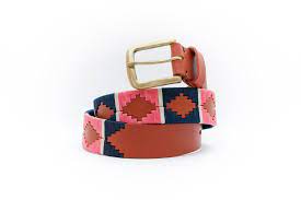 front coiled view of tan belt with green and pink alternating diamond pattern and gold buckle