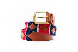 front coiled view of tan alternating blue and red diamond pattern belt with a gold buckle