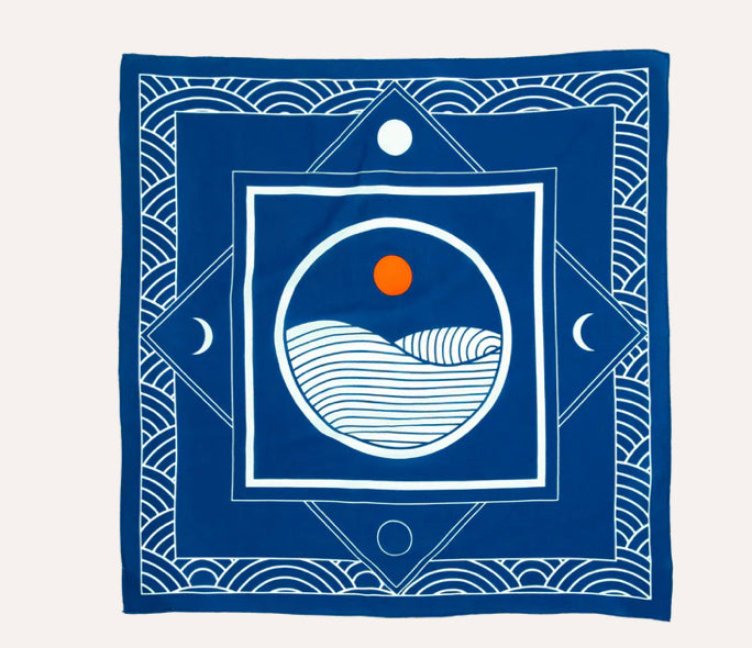 bandana with minimalistic linear blue and off-white encircled wave design bordered with level and diagonal square borders and a frame of concentric circles 