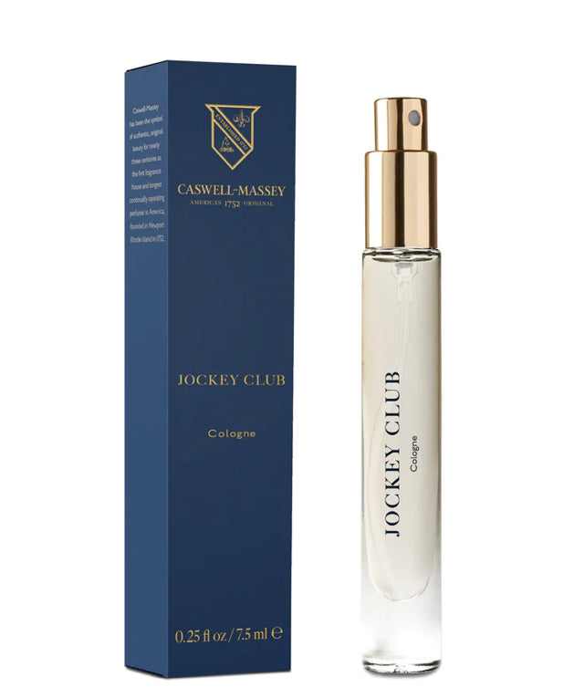Ace Rivington Caswell-Massey Eau de Parfum shows a 7.5ml spray bottle of Jockey Club Cologne with a gold cap and clear body, alongside its blue and gold packaging box. The box features the Caswell-Massey logo and text detailing the product's heritage and specifications.