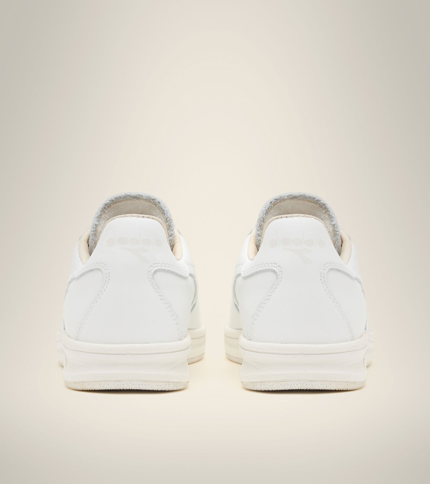 back view of white on white B. elite h italia sport diadora shoes made in italy