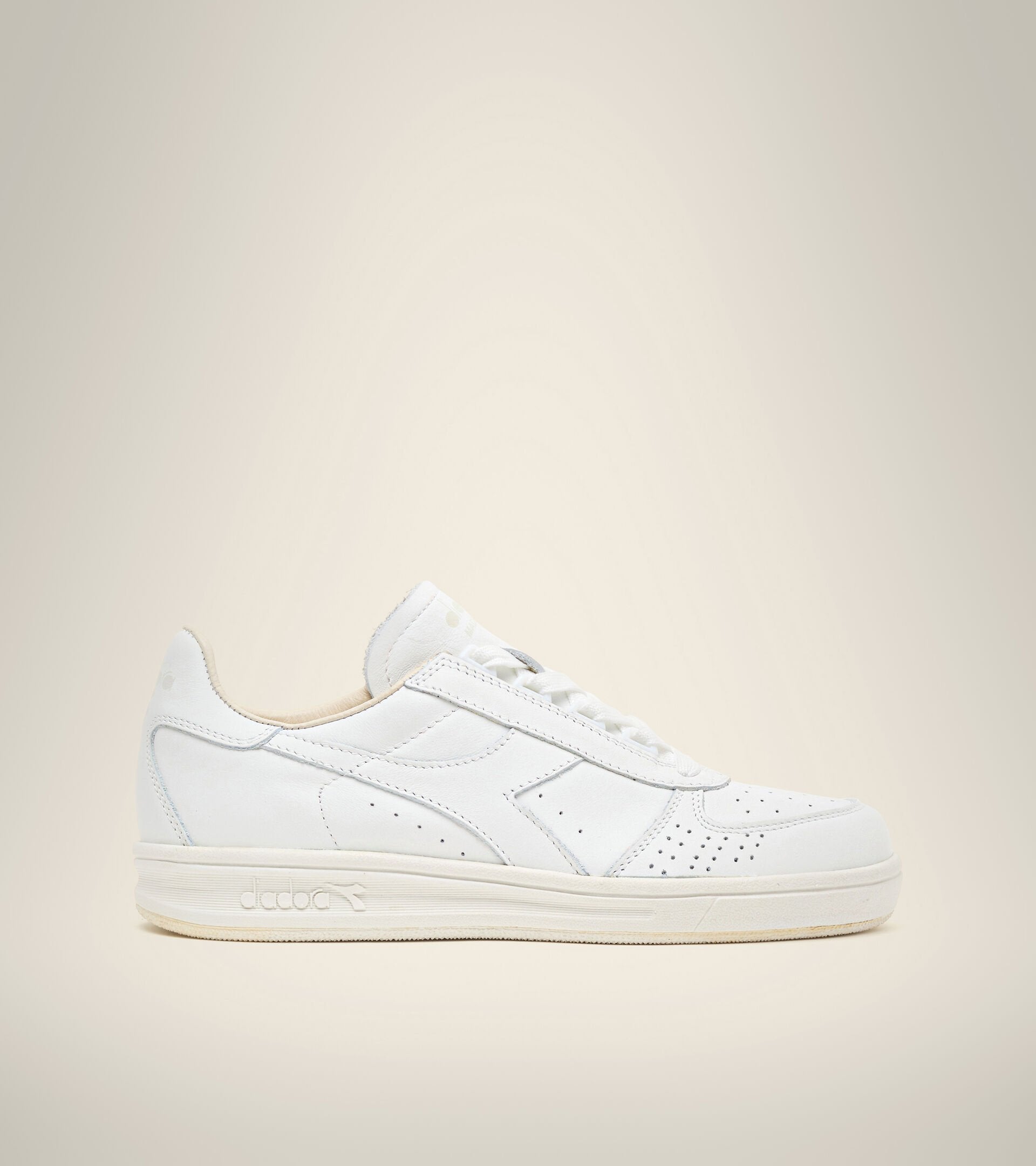 side view of white on white B. elite h italia sport diadora shoe made in italy