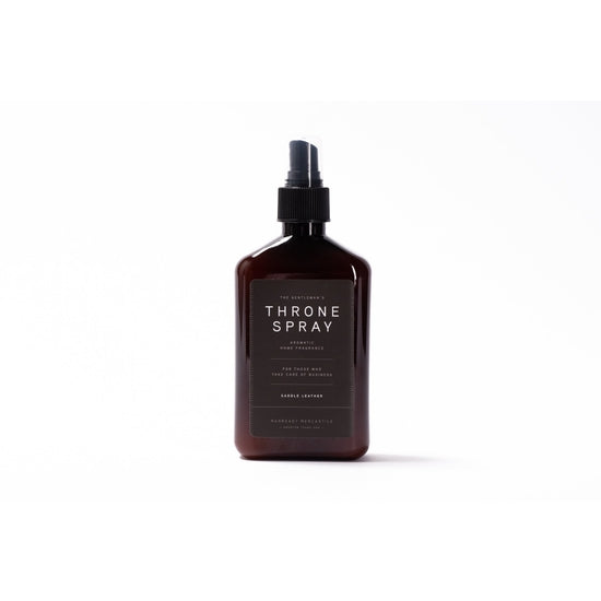 Ace Rivington Manready Mercantile - Throne Spray - Citrus scent. The bottle is dark brown with a black spray nozzle and a black label with white text that reads 'The Gentleman's Throne Spray' and includes details about the product's use and scent.